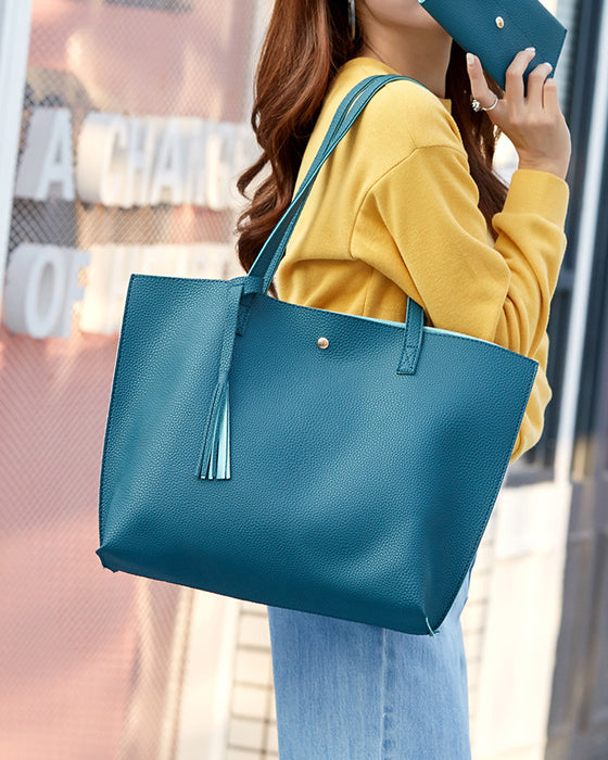 Kapacitet med enfärgad tofs axelväska med stor