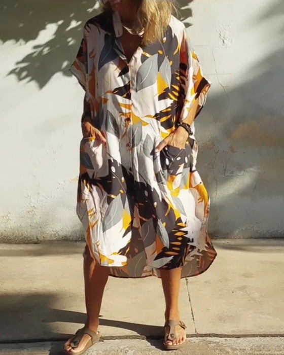 Klänning med fickor och lönnlövstryck