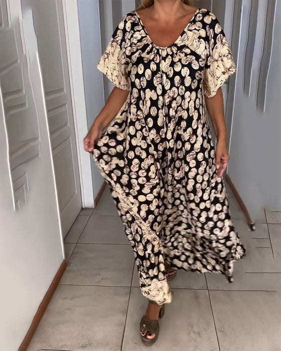 V-ringad kortärmad klänning med tryck