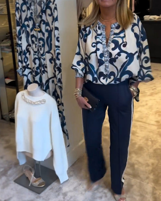 Blus i retromönster med lyktaärm