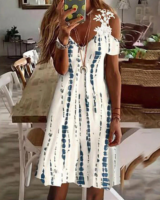 Blommig strandsolklänning