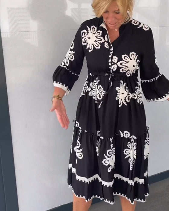 Blommig klänning med 3/4 ärm