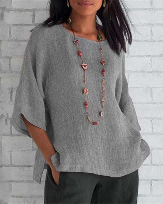 Enfärgad topp med 3/4 ärm med rund hals