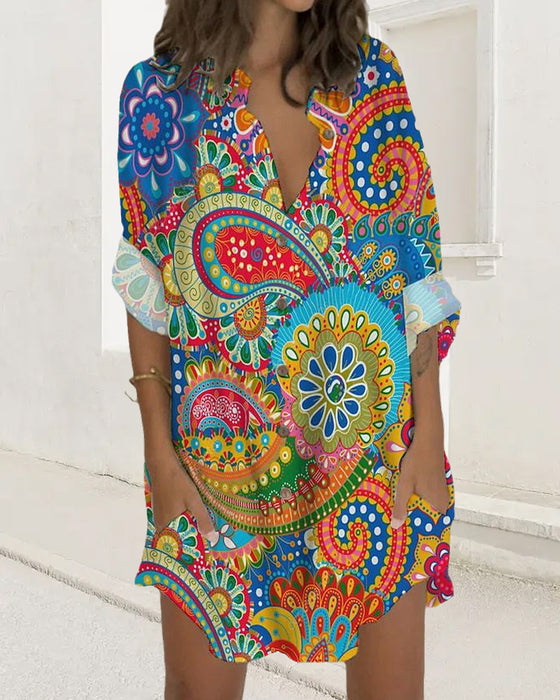 Klänning med knapptryck med lång ärm och ficka