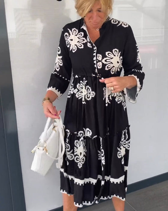 Blommig klänning med 3/4 ärm