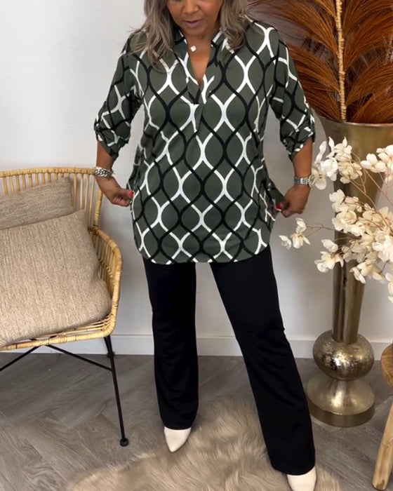 Avslappnad blus med långa ärmar och tryck