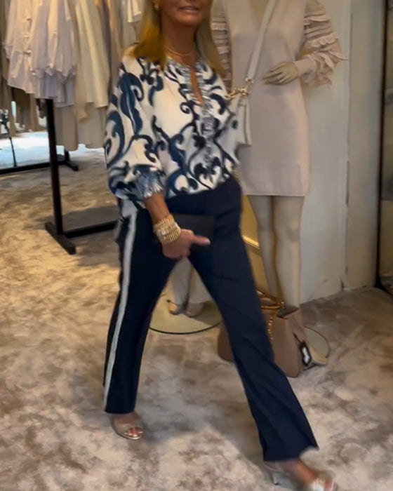 Blus i retromönster med lyktaärm