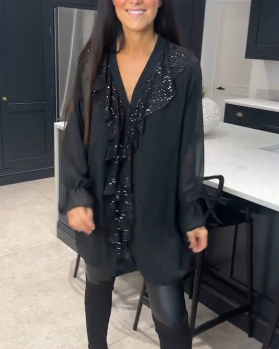 Blus med volanger och elegant stil