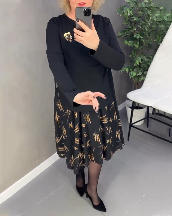 Avslappnad klänning med lös passform och rund hals