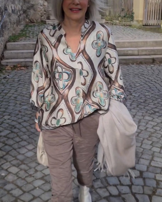 Blus med retrostil och långa ärmar