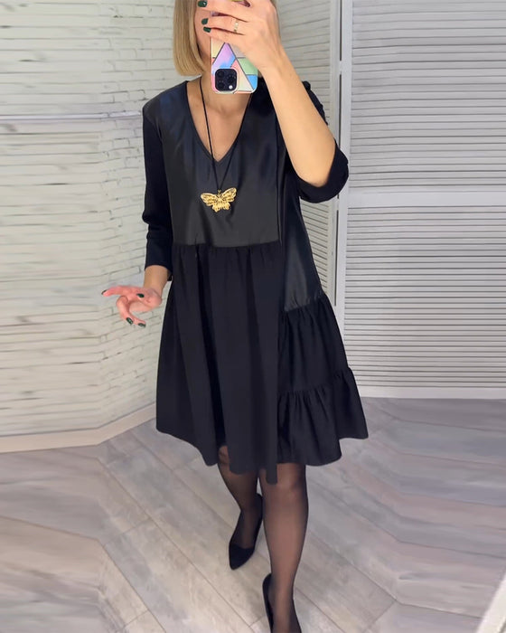 Patchwork klänning med V-ringning