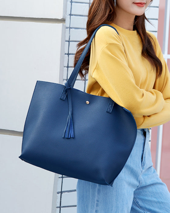 Kapacitet med enfärgad tofs axelväska med stor