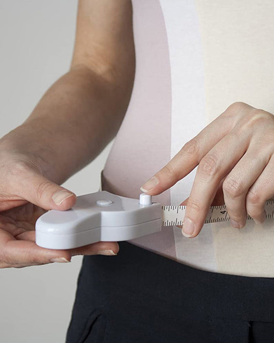 Automatiskt krympande måttband