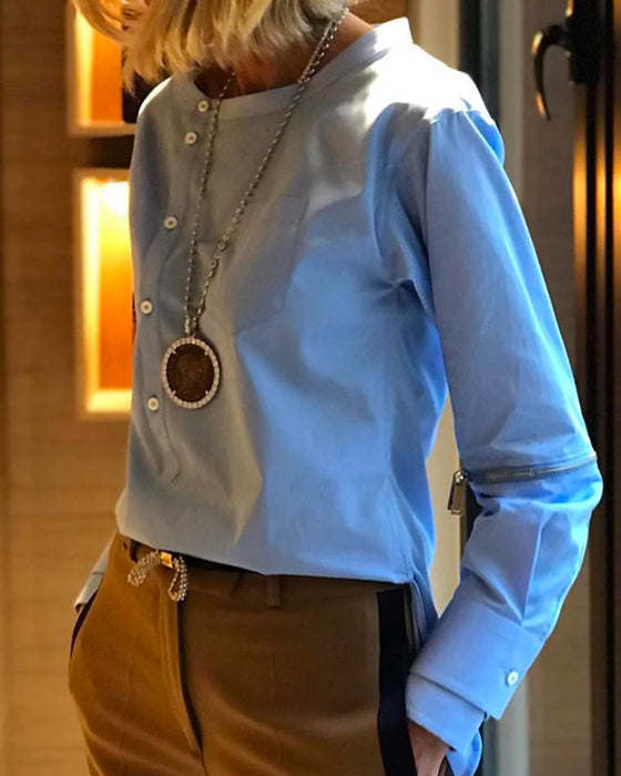 Enfärgad oregelbunden topp med knäppning