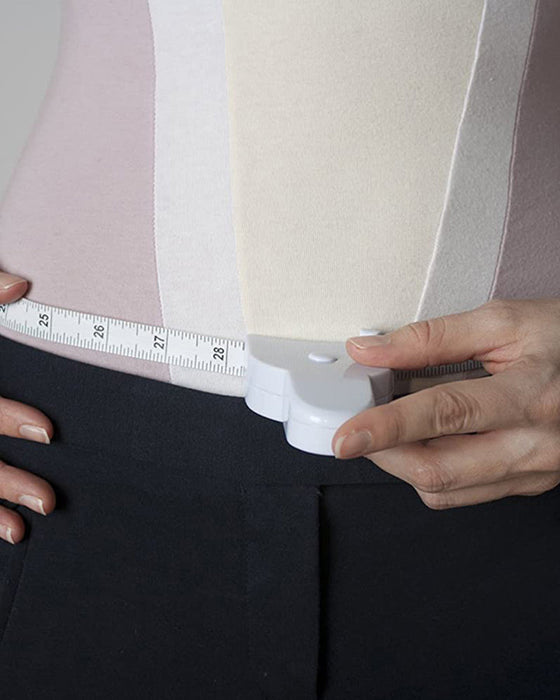 Automatiskt krympande måttband