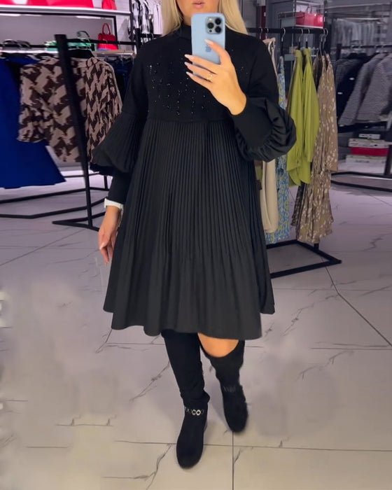 Klänning med ballongärmar och stativkrage