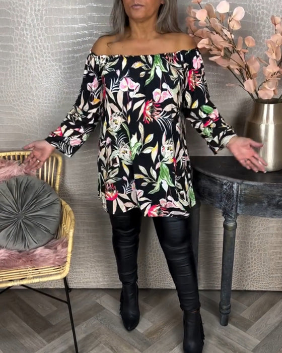 Blus med tryck och en axel