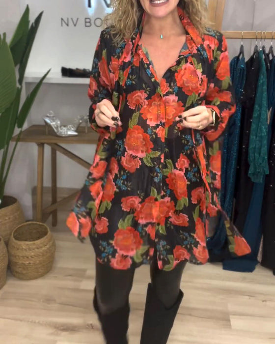 Blus med blommönster och lös passform