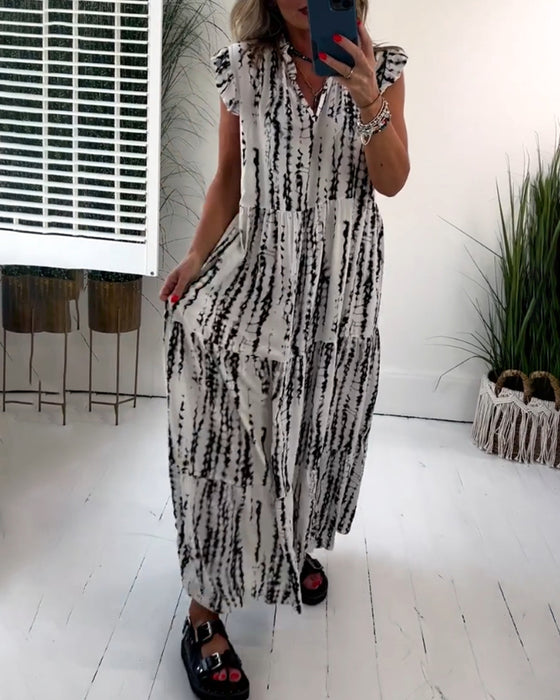 V-ringad klänning med flugärm och tryck