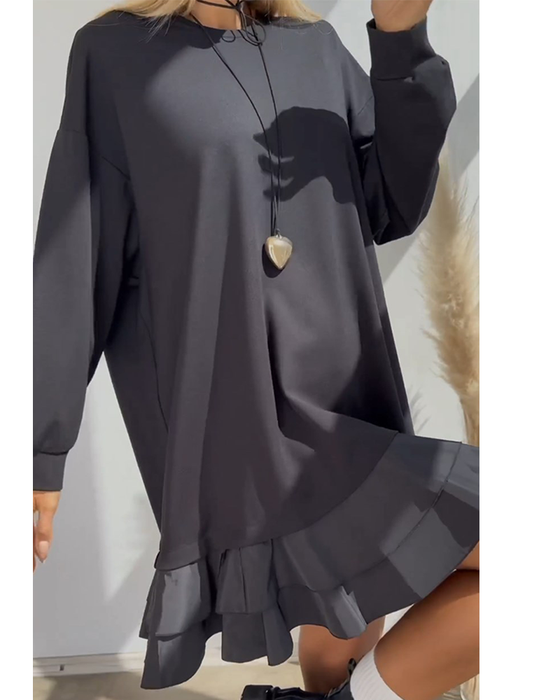 Löst enfärgad klänning med patchwork