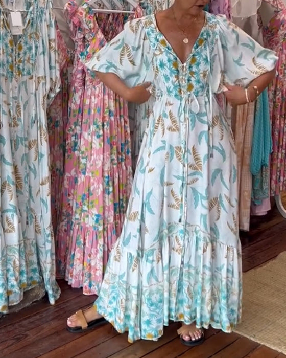 V-ringad maxiklänning med bladtryck för kvinnor