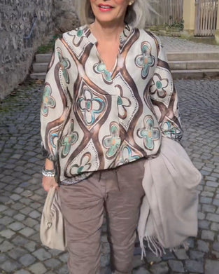 Blus med retrostil och långa ärmar