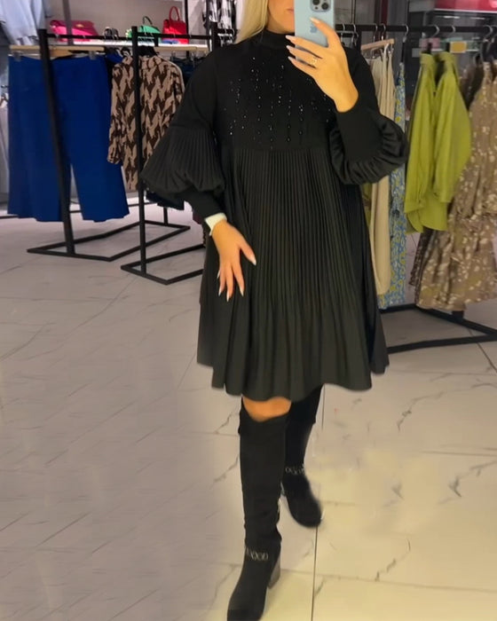 Klänning med ballongärmar och stativkrage