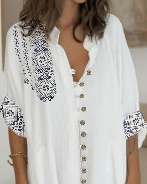 Klänning med 3/4-ärmar och knappar