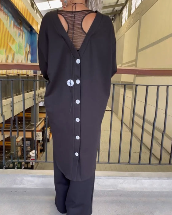 Topp med lös passform och långa ärmar