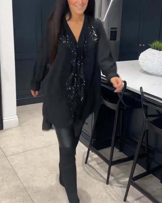 Blus med volanger och elegant stil