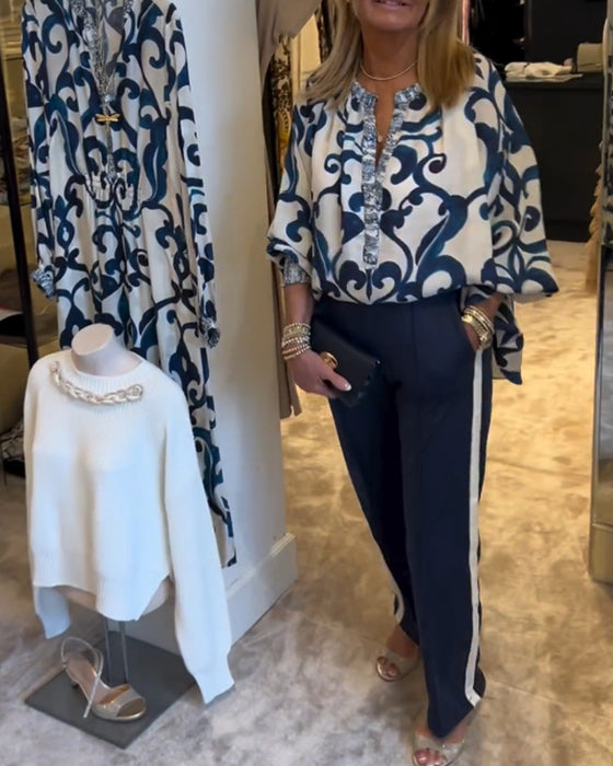 Blus i retromönster med lyktaärm