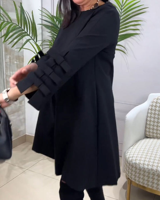 Avslappnad knälång klänning med långa ärmar