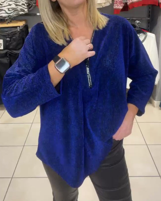 Löst topp med långa ärmar och dragkedja