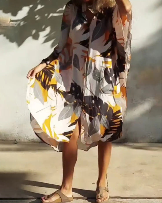 Klänning med fickor och lönnlövstryck